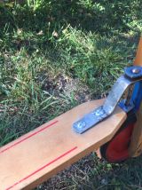 Ancienne trottinette en bois à 3 roues en métal rouge