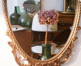 Miroir ancien ovale bronze doré