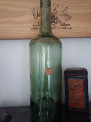 Bouteille ancienne en verre soufflé 