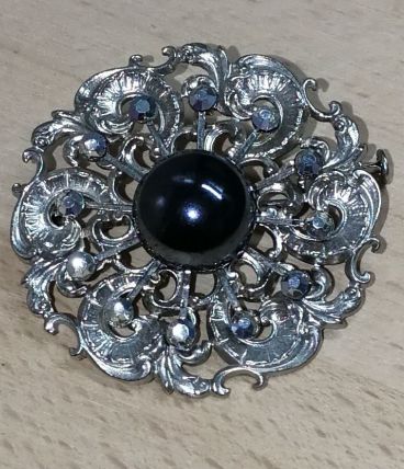 Ancienne broche en métal argenté, brillant