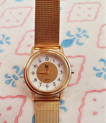 Montre LIP en métal doré