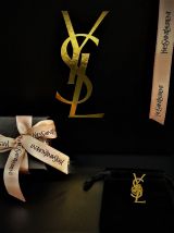 Broche monogramme YSL