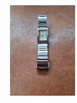 Montre Louis Pion pour femme tout acier inox. Bon état