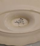 Saucière en faience signée DIGOIN SARREGUEMINES. 