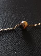 Bracelet en plaqué or jaune et pierres oeil de Tigre