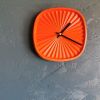 Horloge pendule murale vintage silencieuse Tupperware orange