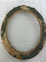 Grand cadre ovale en bois doré, nœud style Louis XVI