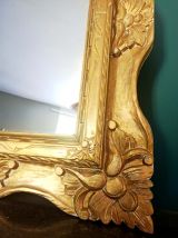 Grand miroir en bois doré 