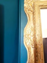 Grand miroir en bois doré 