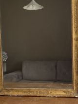 Miroir doré fin 19ème avec décor. 100x80.