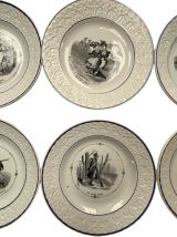 11 assiettes plates ornées de Scènes militaires. Man