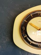 Horloge formica vintage pendule murale Jura jaune